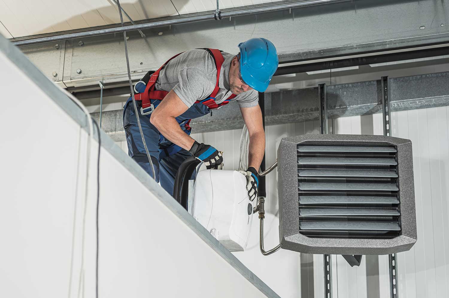 Installing different systems and HVAC equipment through an HVAC technician